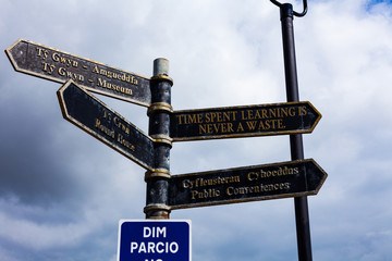 Writing note showing Time Spent Learning Is Never A Waste. Business concept for education has no end Keep learning Road sign on the crossroads with blue cloudy sky in the background