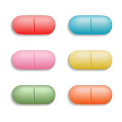 Set of medical colored pills. Oval tablets in 3D style with shadow are isolated on white background. Top view. Realistic vector illustration