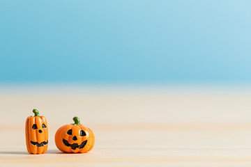 Halloween pumpkins on a table on a blue background