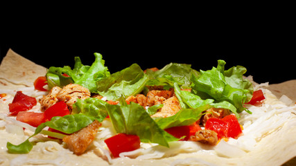 cooking process pita sandwich with fresh vegetables,Concept: healthy food on a dark background 