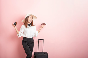 Beautiful traveler woman is exciting in pink background