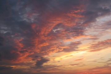 Beautiful orange burgundy sunset background, flame in the sky at sunset