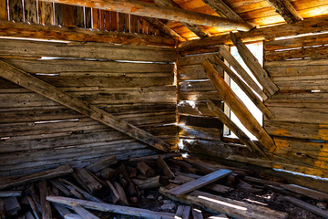 Independence Pass mining townsite wooden cabin interior with sunlight through window in White River National Forest in Colorado