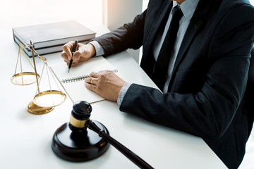 The private office workplace for consultant an young lawyer legislation with gavel and document on...