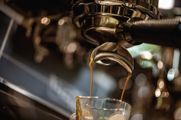 Coffee making by machine. Espresso coffee shot. Machine brewing coffee.