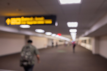 Blur people traveller waiting at gate terminal to boarding airline airplane in airport background.