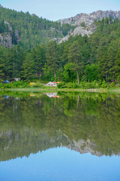 Reflections on a tranquil lake in the Black Hills of South Dakota
