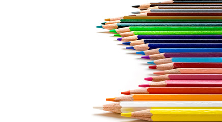 Colored pencils isolated on white background, side view. Wave shaped.
