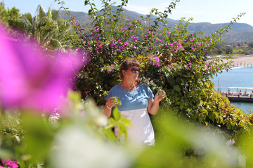 fatal beauty among flowers. Spring mood - woman planted by nature