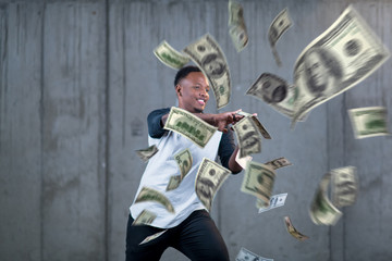 Obraz na płótnie Canvas black businessman making the rain of money