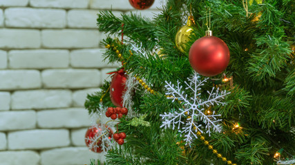 Fototapeta na wymiar Decorated Christmas tree on blurred, sparkling and fairy whiteground