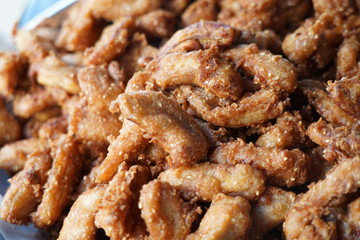 Banana fry in a pan with boiling oil. When finished, looks very appetizing