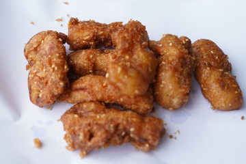 Banana fry in a pan with boiling oil. When finished, looks very appetizing