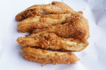 Banana fry in a pan with boiling oil. When finished, looks very appetizing