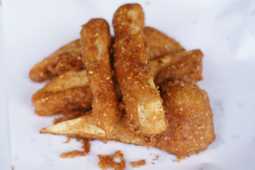 Banana fry in a pan with boiling oil. When finished, looks very appetizing
