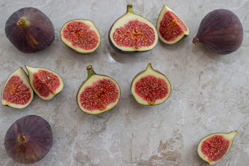 Fresh figs. Whole figs and sliced in half figs in ceramic bowl.
