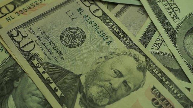 Dollars Close up Concept. American Dollars Cash Money background. Macro view.  Rotation 360 degrees.