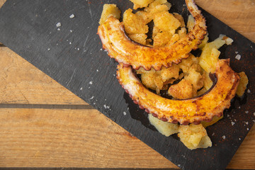 Octopus with paprika, potatoes and olive oil is a typical tapa from Galicia, Spain