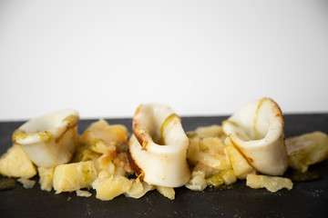 Spanish squid top with potatoes