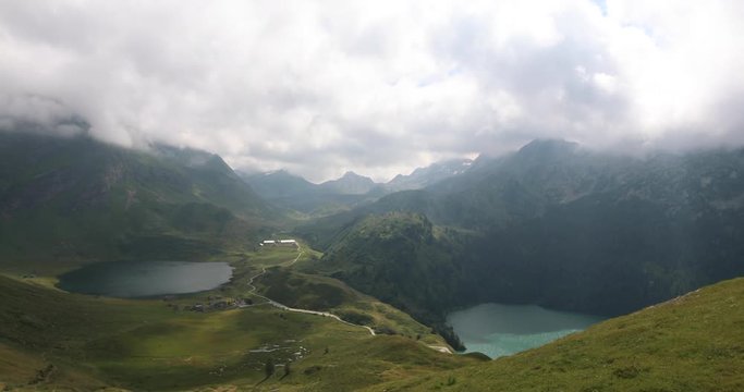 Landscape pan showing the beautiful mountains and lake Ritom in the middle of Swiss Alps