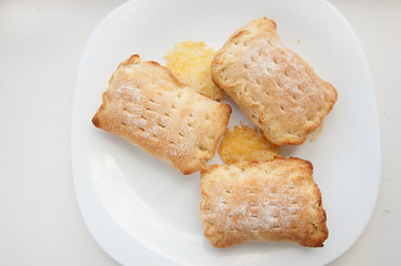 puff pastry with cheese on a white plate, home cooking