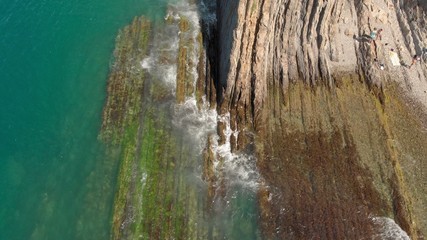 Naklejka premium Flying over the rocky coast with high cliffs sea mountain mountain coast of the ocean. Aerial shot