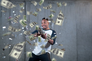 Obraz na płótnie Canvas black businessman making the rain of money