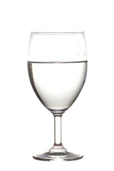 Half water in wine glasses . Isolated on white