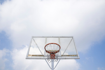 Basketball stand and cloud.