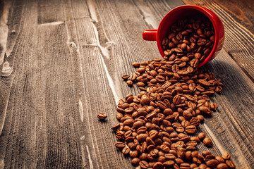Red coffee cup on wooden desk - coffee mood