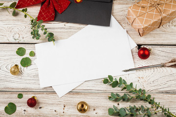 Vintage style composition with weathered paper and quill pen on wooden table close up