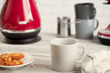 Cup of tea or coffee on modern kitchen background