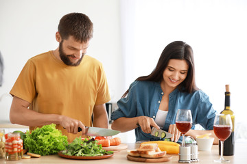 Young couple cooking together in kitchen