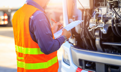 Preforming a pre-trip inspection on a truck,Concept preventive maintenance truck checklist,Check...