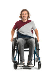 Handsome man in wheelchair on white background