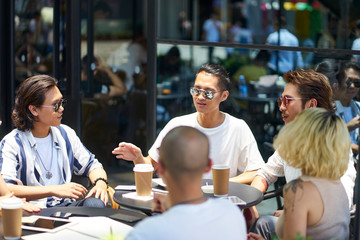 young asian people relaxing in coffee shop