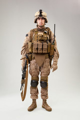 United states Marine Corps special operations command  raider with weapon. Studio shot