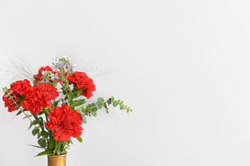 Obraz na płótnie Canvas Beautiful carnation flowers on light background