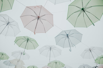 pastel tone Colorful umbrellas background. Colorful umbrellas in the sky
