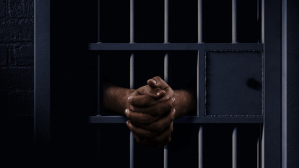 Jail Cell And Black Hands