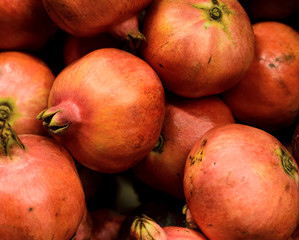 Several big red ripe pomegranate fruit