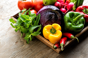 organic food background Vegetables in the basket, Fresh vegetables basket on a wooden table .