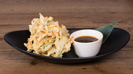 tempura of carrots, zucchini and daikon accompanied by tamari sauce