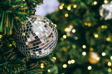 golden christmas ball on green background