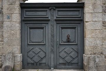 Fototapeta na wymiar close up of an old wood grey carved door
