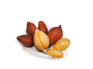 Close-up fresh Salak Fruit (Salacca zalacca) in white plate isolated on white background. Delicious fruit in Southeast Asia.