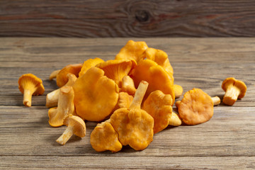 Bunch of chanterelles on an old wooden table