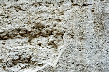 Texture of a concrete wall with cracks and scratches which can be used as a background