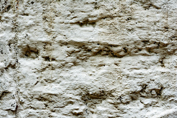 Texture of a concrete wall with cracks and scratches which can be used as a background