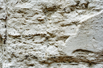 Texture of a concrete wall with cracks and scratches which can be used as a background